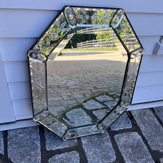 A gorgeous antique Venetian-style mirror with an octagonal mirrored glass frame, entirely hand-etched with delicate floral...