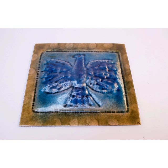 Stunning enamel on copper "eagle" wall plaque in blue with gold trim. The eagle itself bears a dimpled pattern with a...