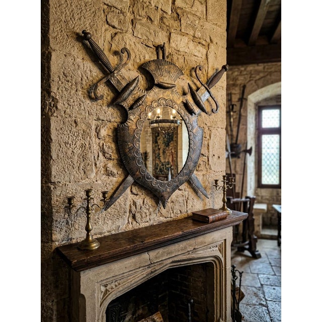 Add a touch of medieval charm and character to your space with this stunning shield-shaped mirror, a true vintage design...