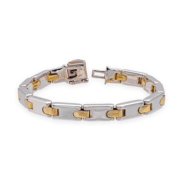 A substantial vintage Tiffany & Co. H Link bracelet crafted in sterling silver with contrasting 18K yellow gold...