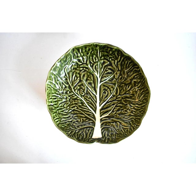 A vintage Portuguese majolica pottery cabbageware leaf large serving dish or bowl in the trompe l'oeil form of a green and...
