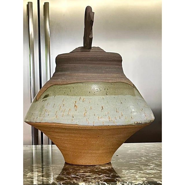 This gorgeous, earthenware, hand-thrown, lidded vessel is truly a work of art! The artist has masterfully incorporated a...