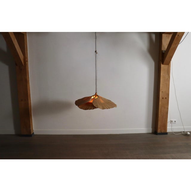 This extremely rare, exquisite pendant lamp, is a part of ingo maurer’s uchiwa series, designed for design m in 1974,...