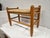 This Danish Modern style rush seat footstool or low bench is ready for use. The stool is in good vintage condition. There...
