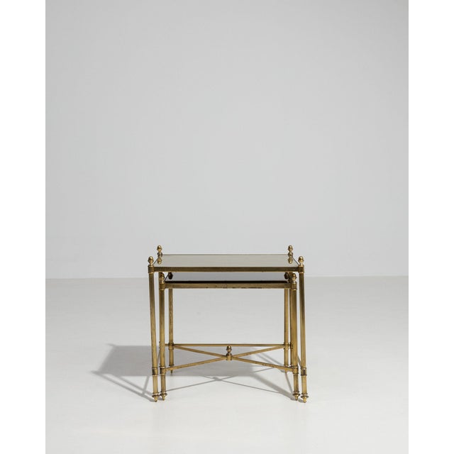 This nesting tables carries genuine presence, its glass tops, brass frame immediately setting the tone for the piece. The...