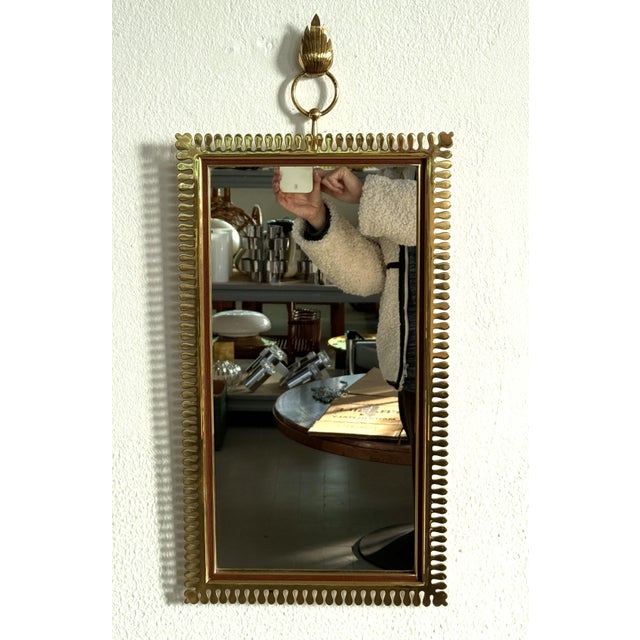 Beautiful wall mirror, made in Germany in the 1970s by excellent craftsmen of the Vereinigte Werkstätten München. The...