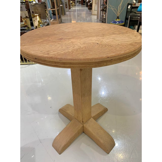 A hand crafted, rustic pedestal table. Heavy and substantial. Beautiful light wood tones in unfinished wood.