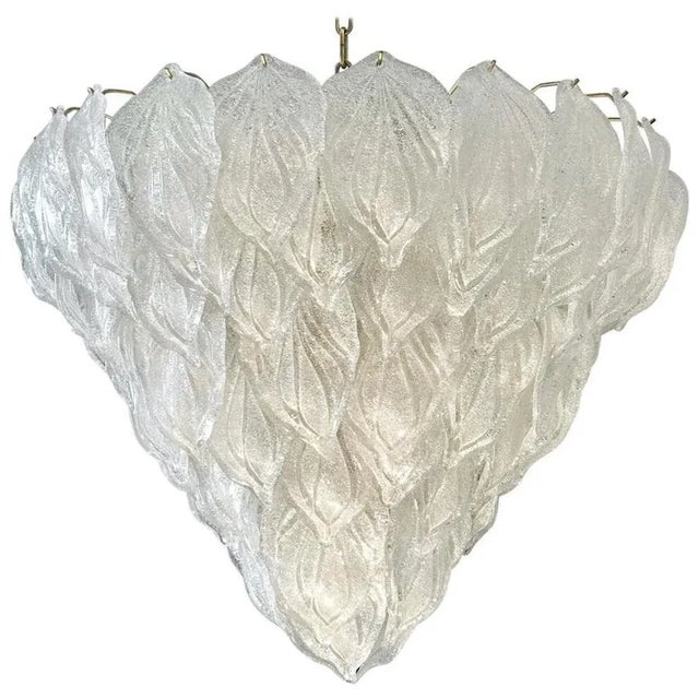 Murano polar ice color chandelier, each with 88 precious hand blown glass leaves hanging on the brass frame. Spectacular...