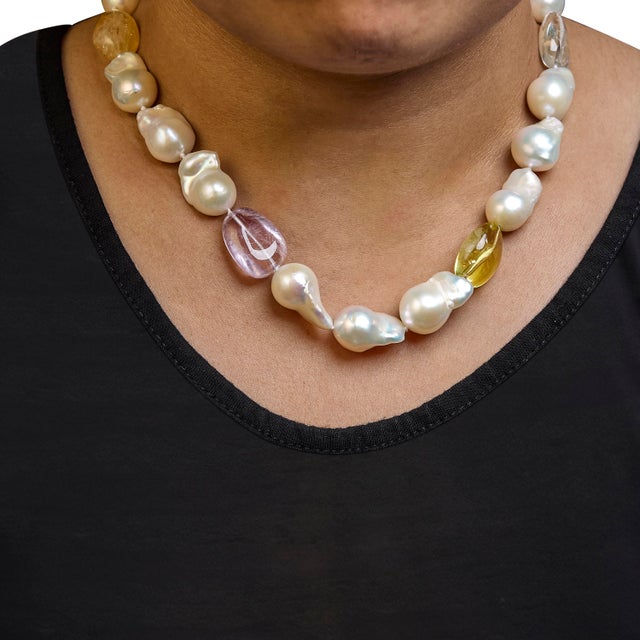 Discover the timeless elegance of the 14K Yellow Gold Citrine, Amethyst, and Baroque Pearl Strand Necklace, a captivating...