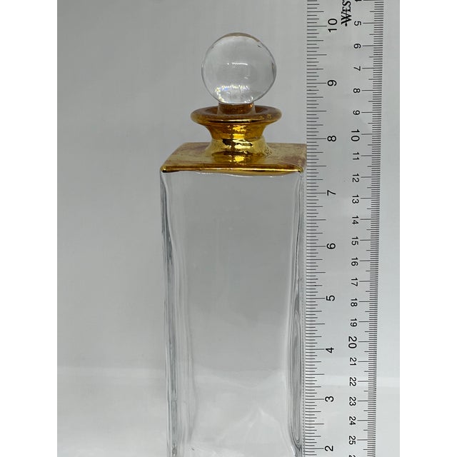 Elegant crystal decanter with gold accents made by Mette Ditmer of Denmark.