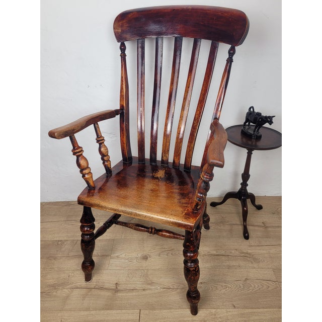 This is an exquisite 19th century high back kitchen armchair, with beautiful Victorian period features. Displaying a...