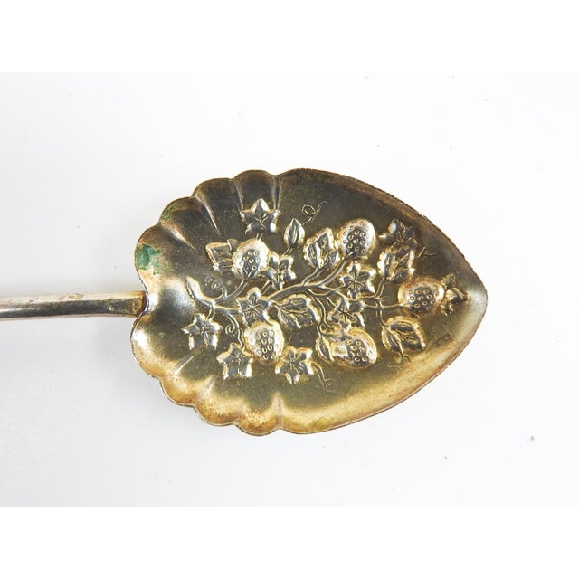 Set of 18 vintage silverplate berry spoons, some still haveing the gold color butlers finish. Repousse strawberry pattern,...