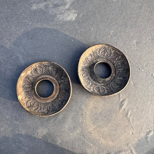 Zinc with a golden finish. Can be used for door handle rosettes or a ceiling medallion for a chandelier or semi flush...