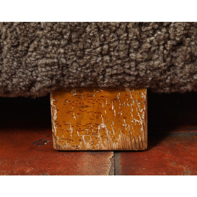 Vintage 20th century sturdy cube footstool in plush grey shearing with wood block feet.