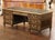 Commanding in scale and exceptionally detailed, this antique executive desk would make a striking centerpiece for a...