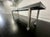 Vintage style metal Industrial table on wheels, circa 2000 Industrial table made of steel on wheels.