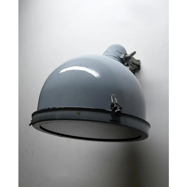 Industrial lights in an interesting light blue color that will blend perfectly into modern interior design at home or in...