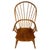 A charming early 20th-century English rocking chair, finely crafted from ash and distinguished by its traditional spindle...