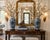 A striking pair of blue and white Chinese Export style porcelain baluster vases featuring richly detailed scrolling floral...