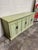Love this color! Green with bird egg blue undertones. Flecked speckled black all over. Brass pulls. Solid wood. See photos...