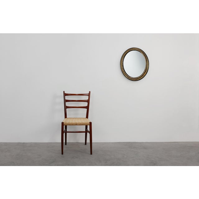 This elegant Neo‑Classical oval mirror from France brings together refined geometry and rich decorative detailing. The...