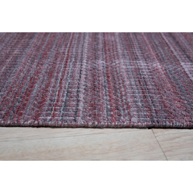 Radiant Elena Coral Handmade Wool Rug, Country of Origin: India. This exceptional piece introduces a sophisticated,...