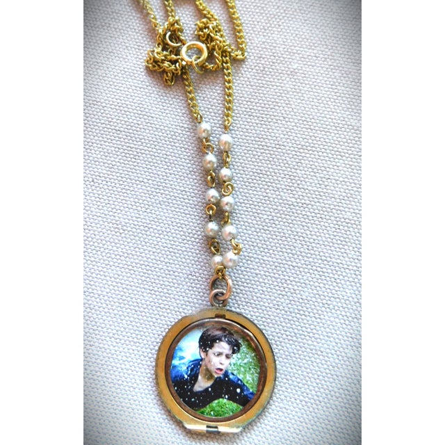 Antique 10K turn of the century round locket half becomes a beautiful open-faced locket perfect for a small picture. The...