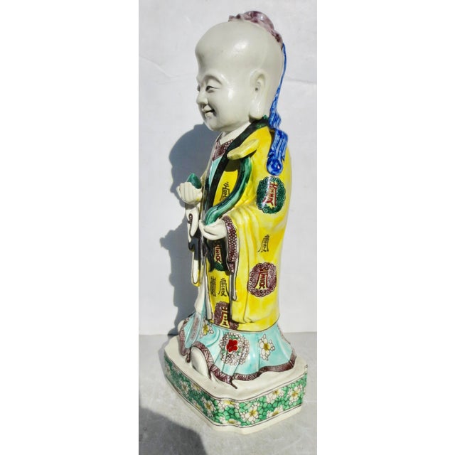 Shoulao, the God of Longevity, Chinese porcelain, It is decorated in the famille rose palette with various symbols and...