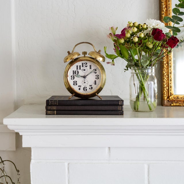 This vintage Elgin dual bell alarm clock features a storied blend of elements that juxtapose and balance each other. For...