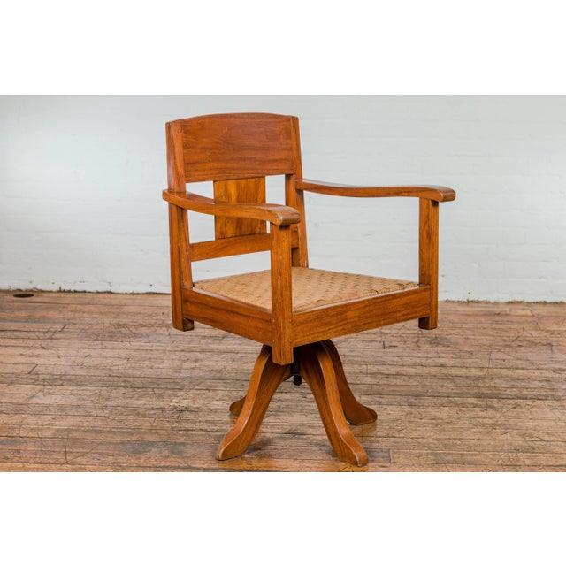 Midcentury Wooden Swivel Chair with Woven Rattan Seat and Quadripod Base For Sale - Image 10 of 12