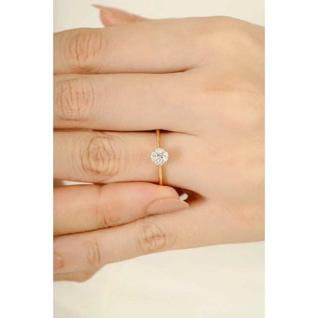 This minimalist 14K solid yellow gold ring features a dazzling cluster of five marquise-cut diamonds totaling 0.24 carats,...