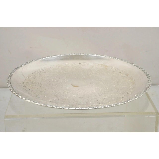 Vintage WM Rogers 767 Victorian Style Round Silver Plated Serving Platter Tray. Circa Mid 20th Century. Measurements: 1" H...