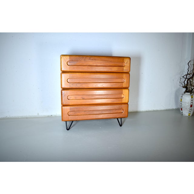 This is a high-quality teak chest of drawers from Denmark. The chest was made in the 1970s. It features warm teak wood,...