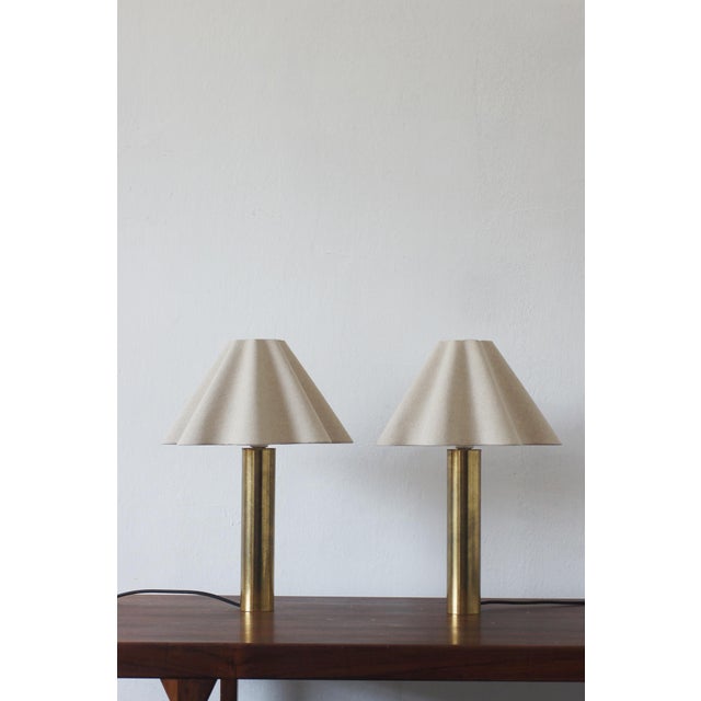This pair of brass table lamps from Scandinavia perfectly captures the essence of Northern European design from the second...