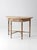This antique 19th century demi lune table carries the worn character and understated proportions of an early American...
