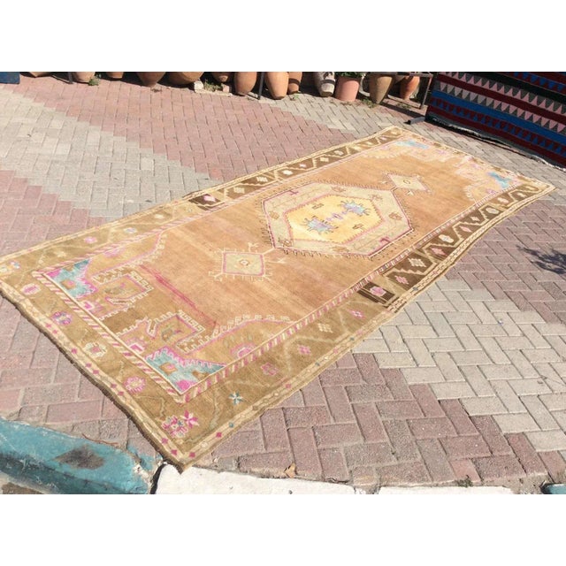 This gorgeous Hand knotted Vintage Anatolian area rug is approximately 70 years old in excellent vintage condition. The...