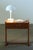 This small teak bedside table has a simple design and a single drawer. It’s a good size for rooms with low beds or floor-...