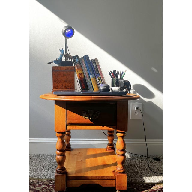 Solid wood table with a medium dark walnut stained finish. Drawer is stained slightly darker giving the piece a unique...