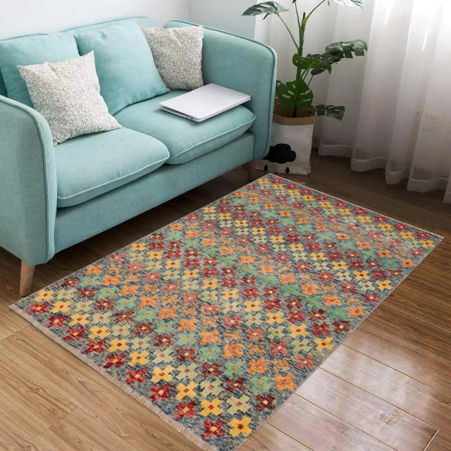 A mesmerizing addition to any decor, this exhilarating hand-knotted rug featuring exquisite coloration in an intricate...