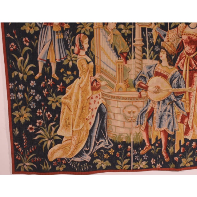 Exquisite tapestry depicting the Concert at the Fountain, woven in wool and linen. A beautiful tapestry that has retained...