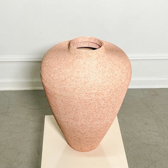 Large 1980’s postmodern vase in corrugated cardboard in a peachy sunset hue. Attributed to Gregory Van Pelt. Marked Flute...