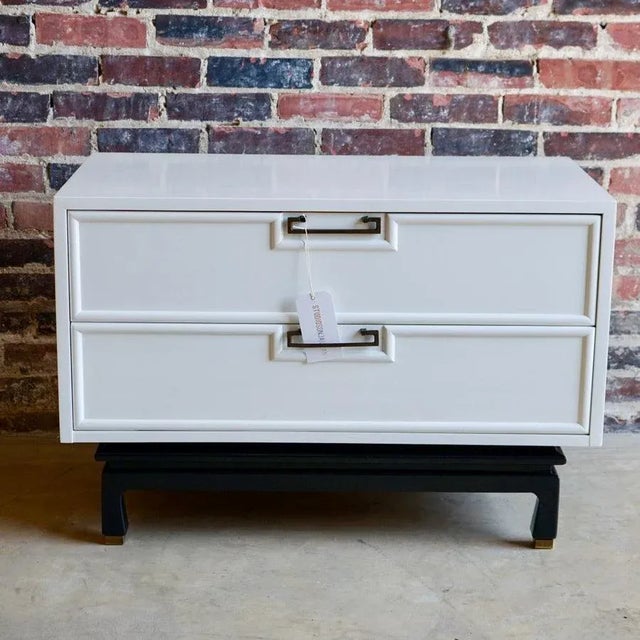 Large lovely mid-century nightstand by American of Martinsville. It has a chinoiserie feel. Black lacquer base with brass...