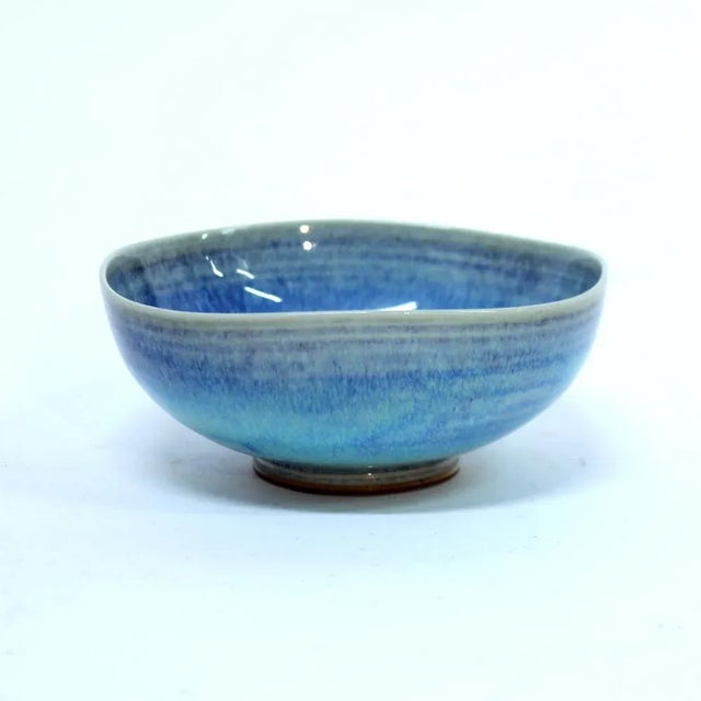 Light blue Aniara bowl designed by Berndt Friberg for Gustavsberg in the 1950s. The colour has a large mix of blue hues...