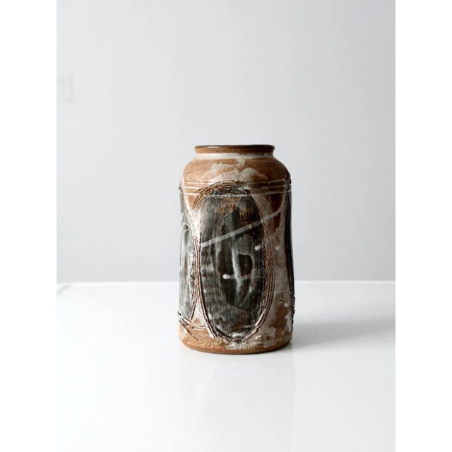 Vintage studio pottery vase signed by the artist Sauer. Hand-crafted form features a squared body with a rounded opening,...