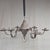 A charming antique early 1900s traditional punched tin New Mexican Spanish Colonial style six-arm candle chandelier. The...