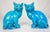 Early 20th Century pair of Chinese Export porcelain cat figures in saturated turquoise blue glaze. The cat figures are...