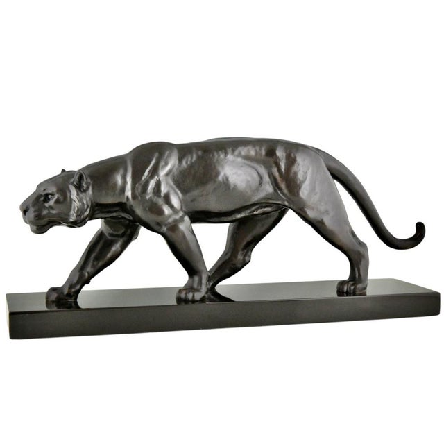 Art Deco bronze panther sculpture by Alexandre Ouline. Bronze with black patina on Belgian black marble base France ca....