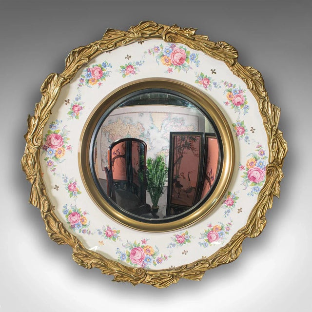This is a vintage convex mirror. An English, glass and ceramic wall mirror with Italianate taste, dating to the early 20th...