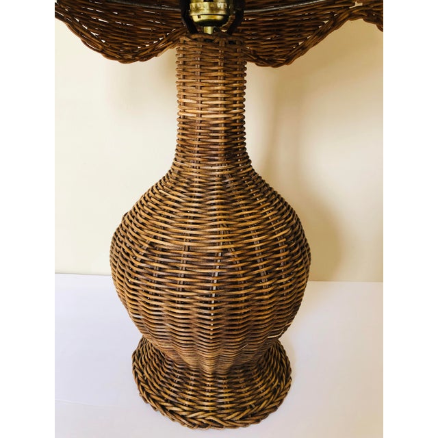 Vintage wicker table lamp with wicker shade.