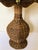 Vintage wicker table lamp with wicker shade.